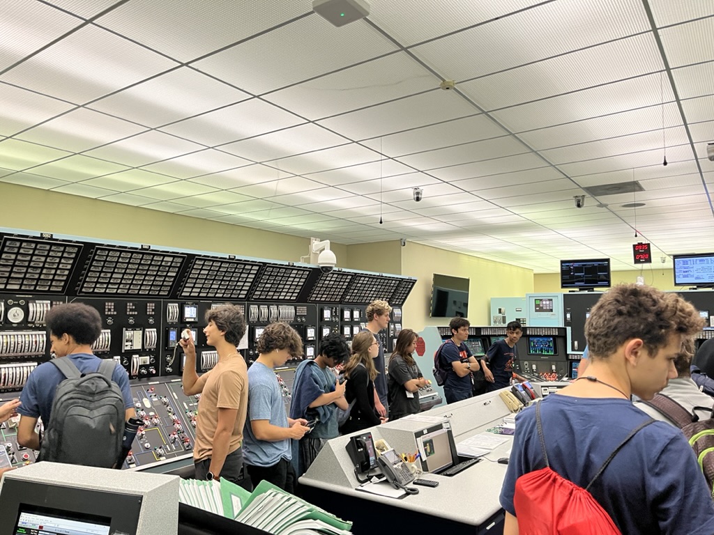 Campers walking around a lab with various demonstrations
