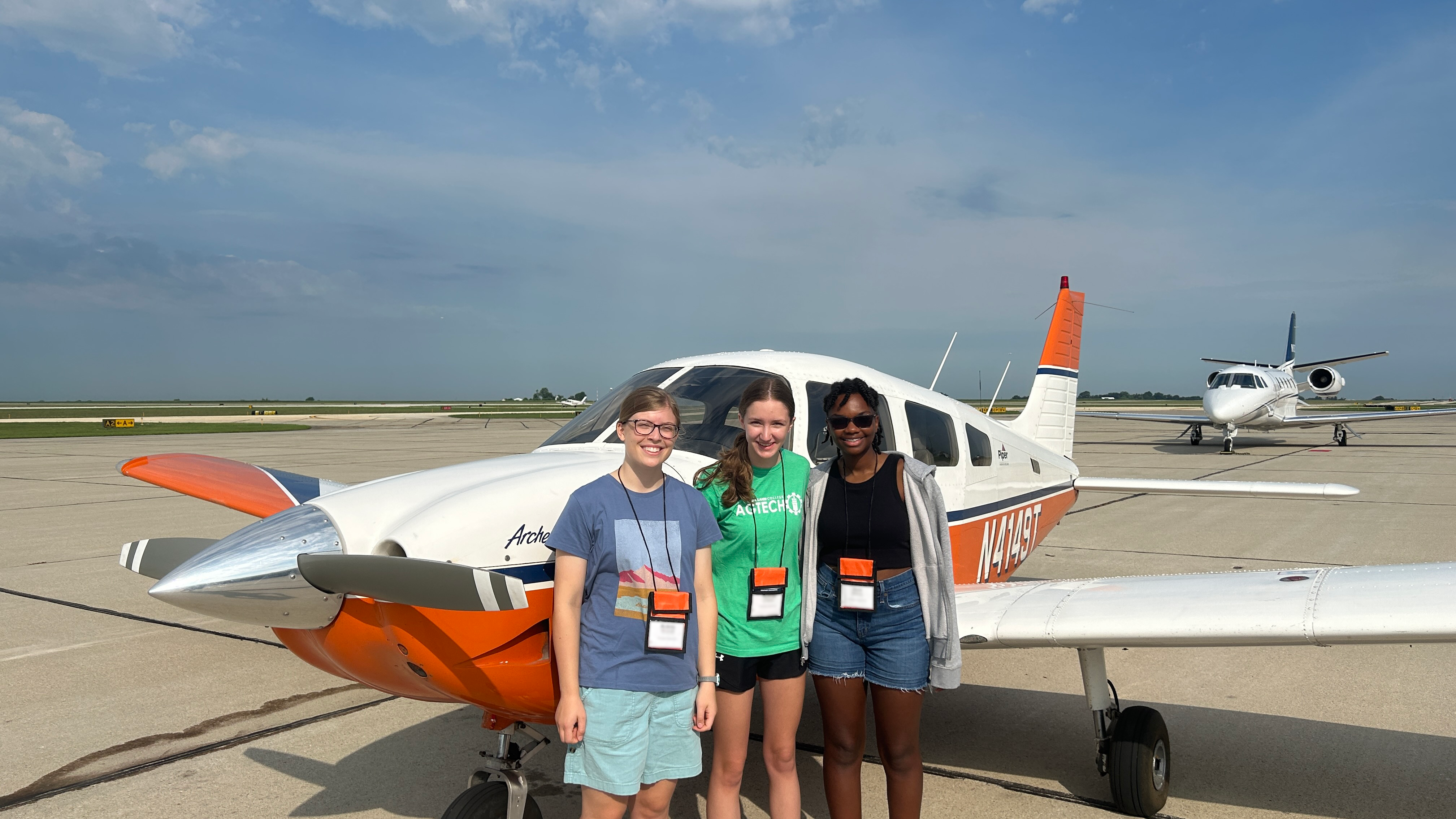 Program participants from 2023 prepare to fly in a small airplane at the Institute of Aviation at Willard Airport.